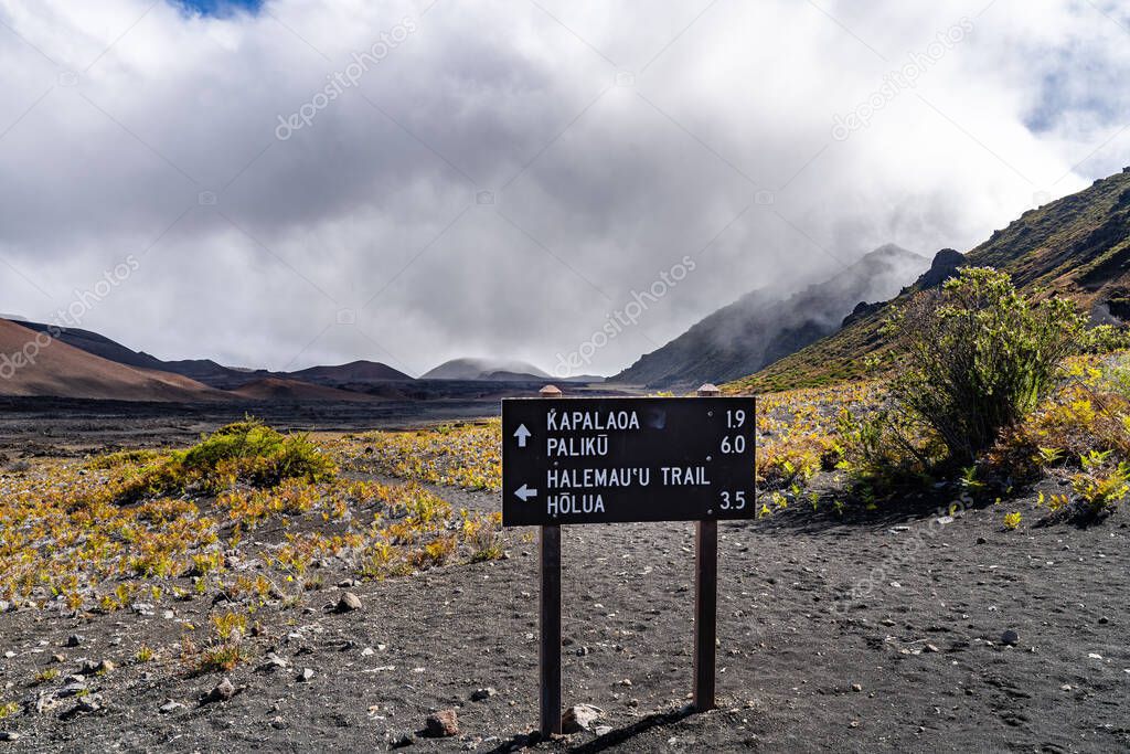 A hiking trail sign located in the crater at Haleakala National Park, Maui, Hawaii. This sign is on the Sliding Sands Trail.