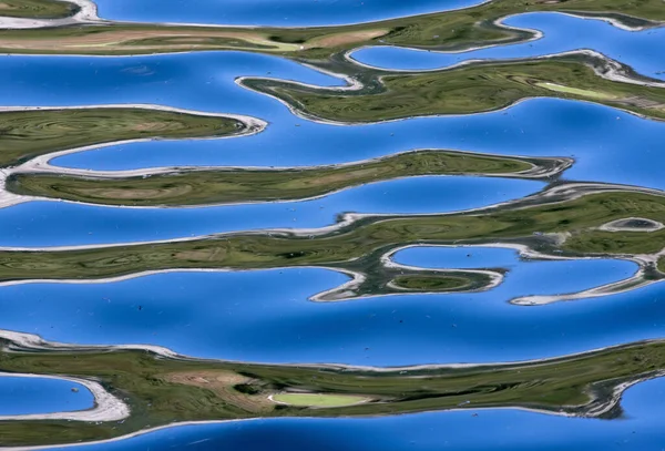 A closeup with ripples on the water surface, nature, waves