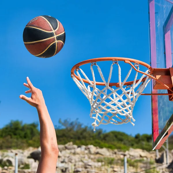 Basketball is headed for the basket after a player\'s shot
