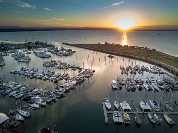 A scenic bird\'s eye view of boats in Scarborough during sunrise, Australia