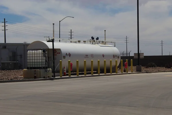 A diesel tank and DEF tank with yellow bullards in Phoenix, United States