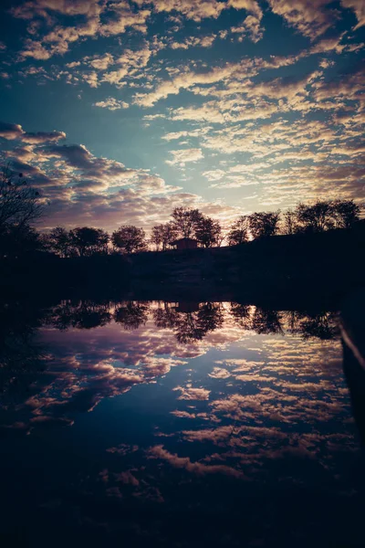 Scenic View Cloudy Sky Reflecting Pond Water Silhouette Trees Sunset — Stock Photo, Image