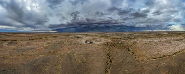 A dark stormy sky over rural brown fields in Australia