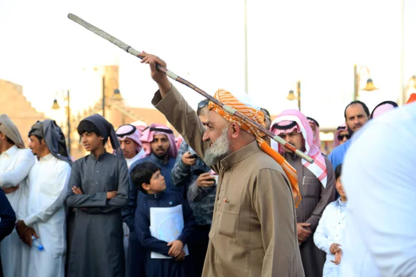 Arabic Man Doing Traditional Stick Dance Smiling — Stock Photo, Image