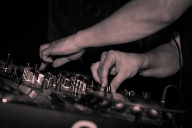 The DJ making music waves in the party closeup of the instrument