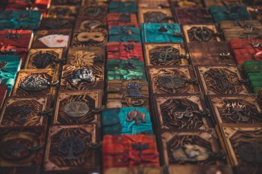 A closeup of rows of notebooks with wooden covers at the Notting hill market in London