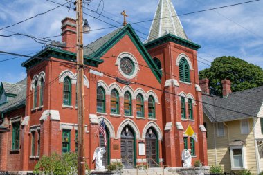 The view of Our Lady of Loretto Church facade against the blue sky. Cold Spring, United States.