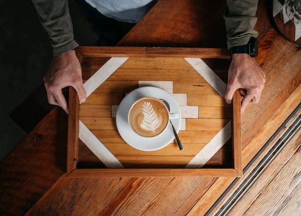 Overhead Shot Male Holding Cappuccino Wooden Table — Stok fotoğraf