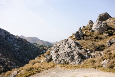 A beautiful summer day near the mountains at the Kourtaliotiko Gorge in Crete, Greece under a blue sky