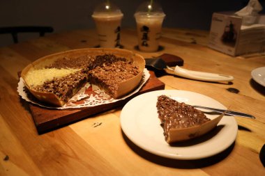 A closeup shot of a sweet omelet cake on top of a wooden table in Indonesia