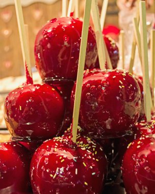 A vertical close-up shot of some candied apples.