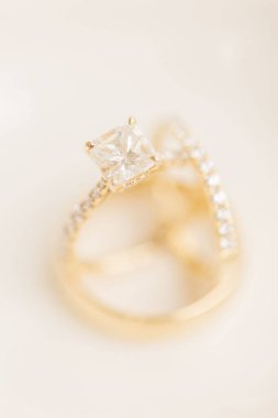A selective focus of a wedding ring with diamonds