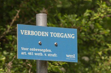 A selective focus shot of a blue sign in Eys village, the Netherlands, where groundwater is pumped