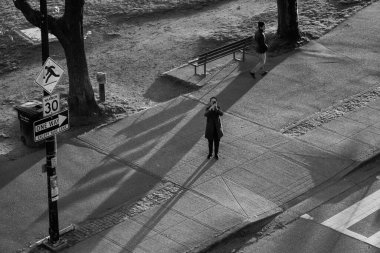 A black and white shot of pedestrians on Vancouver sidewalks, Canada