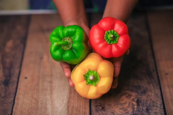 bel peppers capsicum on a wooden tab