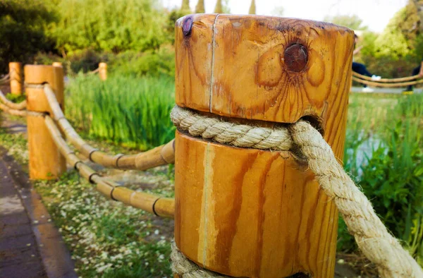 Closeup Shot Ropes Tied Wooden Poles Field —  Fotos de Stock