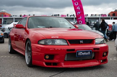 Front parked Red Nissan Skyline GT-R R33