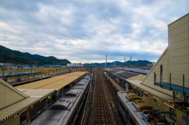 A closeup of a Train station on a cloudy day