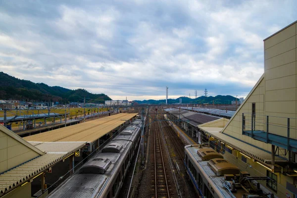 A closeup of a Train station on a cloudy day