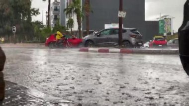 Renault clio 4 making a turn around during a stormy day outside
