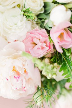 A vertical shot of a bouquet with beautiful peony roses