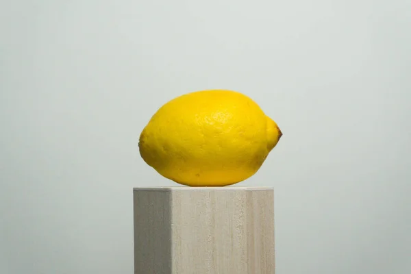 Whole Yellow Lemon Wooden Stand Isolated Gray Background —  Fotos de Stock