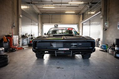 Black Racing Dodge Charger in the pits