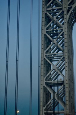 A vertical shot of a tall metal construction at sunset