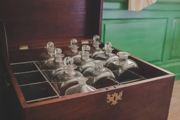 A vintage mini bar with glass bottles