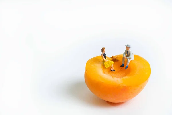 Couple Sitting Apricot Half Having Conversation White Background Copy Space — Stock Photo, Image