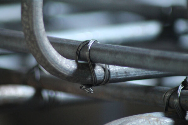 A closeup shot of metal rods in a blurred background