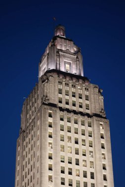 A low angle shot of the Empire State Building in the evening