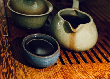 A closeup shot of clay decorative cups and jugs