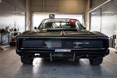 Black Racing Dodge Charger in the pits