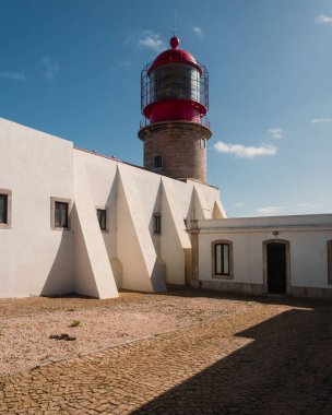 A lighthouse on a sunny coast