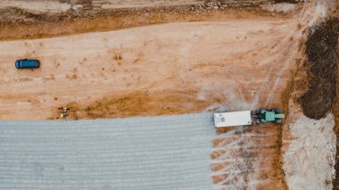 An aerial view of machinery at the construction process