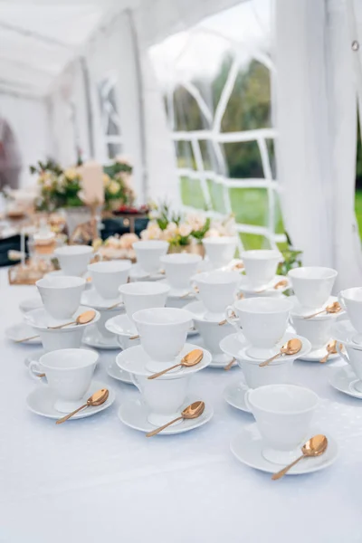 Vertical Shot White Teacups Saucers Gold Spoons Set Aside Table — Stock Photo, Image