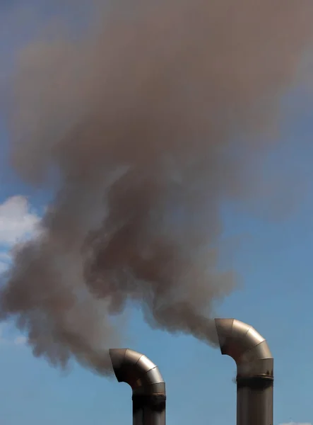 Black smoke from two truck exhausts, pollution, toxic, car