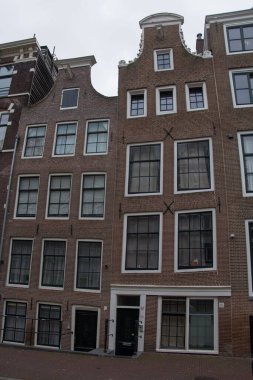 A vertical shot of an old building facade in Amsterdam, Netherlands