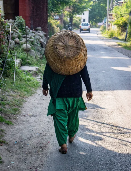 Vertical Back View Man Carrying Basket His Back Walking Street — Photo