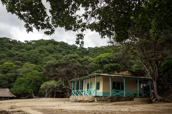 A house in the woods on a cloudy day