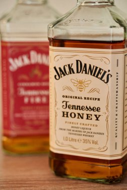 The bottles of Jack Daniels Tennessee Honey whiskey bottle on a table