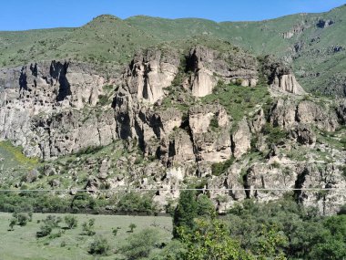 The cave monastery site in southern Georgia, Vardzia with a beautiful view of the Caucasus mountains.