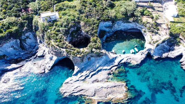 Latina 2022. Aerial view of coast and the beautiful crystalline sea of island of Ponza. There are some skull-shaped sinkholes. May 2022, Lazio, Italy