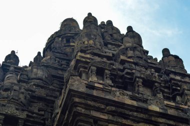 A low angle shot of an exterior of the Prambanan Temple with Hindu carvings, Indonesia