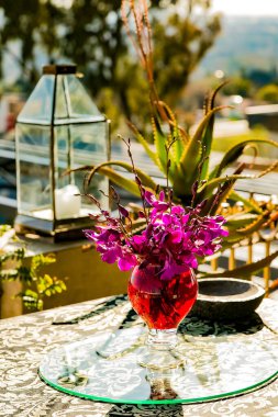 A purple themed floral decor in venue for party event