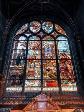 A vertical shot of a stained glass window in the Church of Saint Eustache, Paris, France