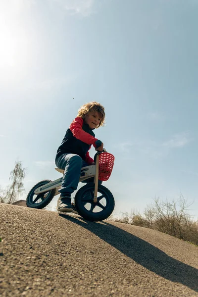 Vertical Shot Playful Autistic Boy Riding Bike Sunny Park — Foto Stock