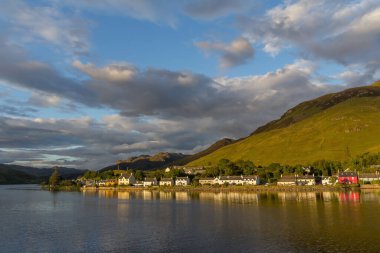 A scenic view of the Chilean Eilean Donan Castle on the island of Skye with a view on a body of water in Great Britain,