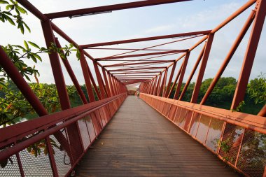 slanted orange red colored bridge